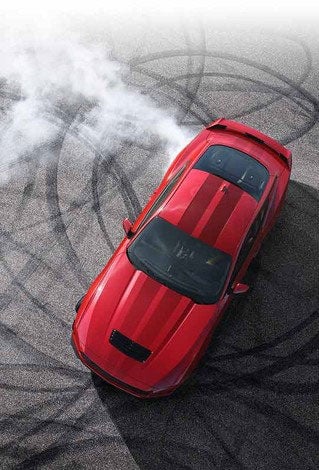 Overhead view of a 2024 Ford Mustang® model with tire tracks on pavement | Jim Hudson Ford in Lexington SC